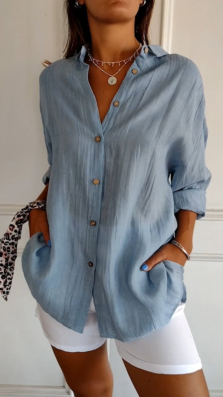 Women's blue loose fit lightweight long sleeve button-up blouse
