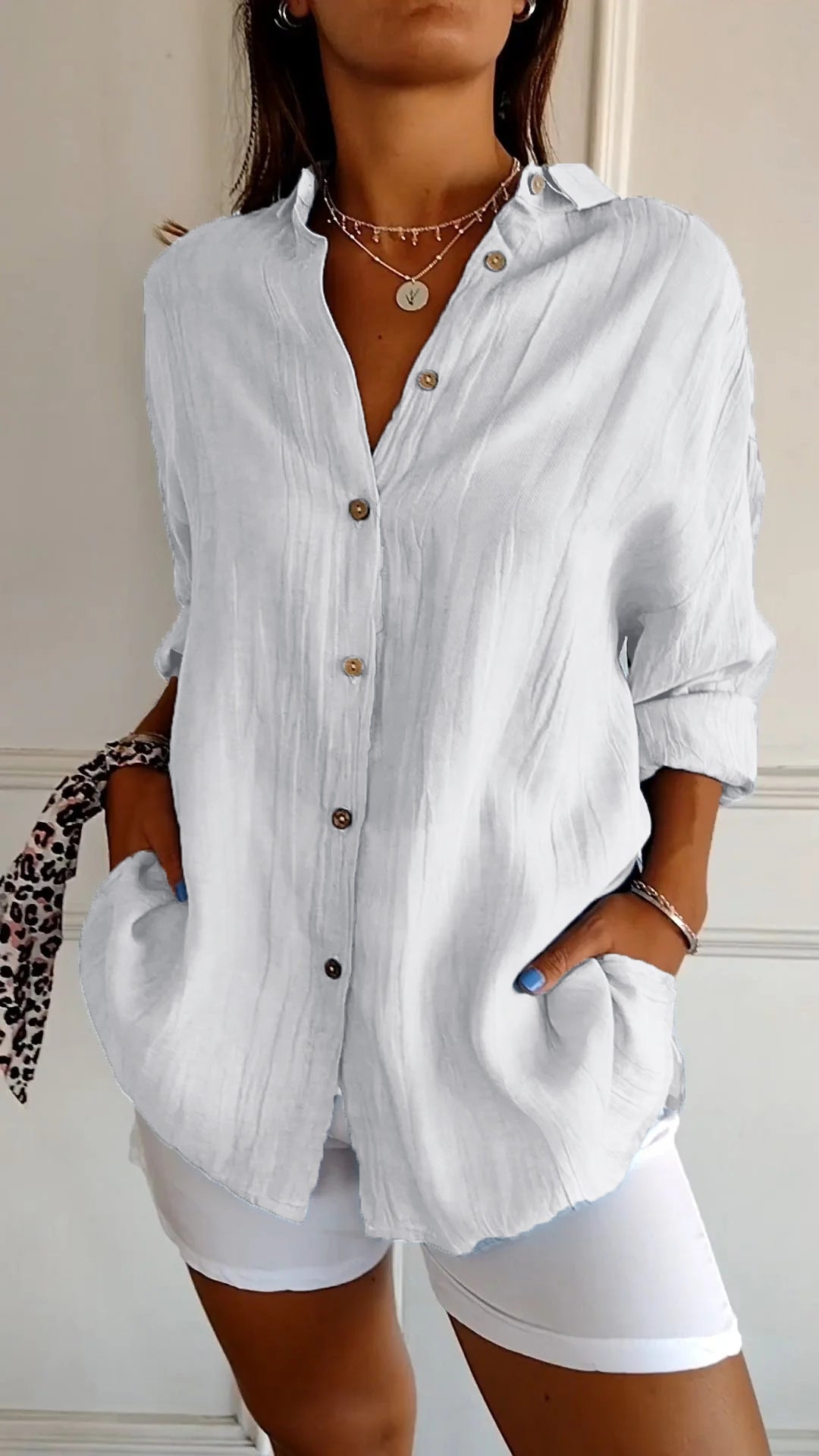 Women's white loose fit lightweight long sleeve button-up blouse