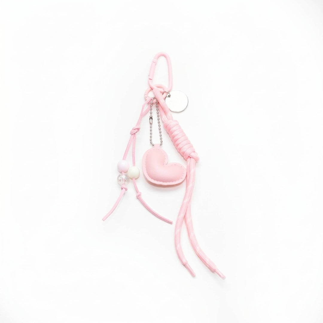 Pink padded heart bag charm with a beaded cord