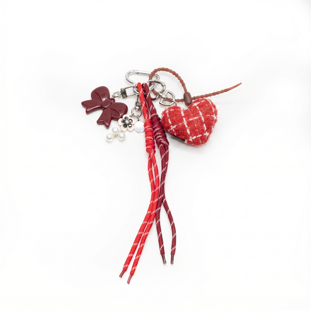 Red tweed padded heart bag charm with cords and charms