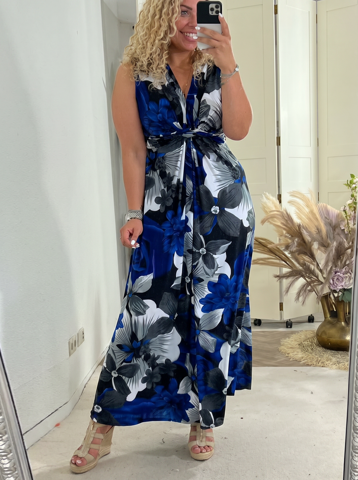 Woman wearing a blue floral sleeveless maxi dress