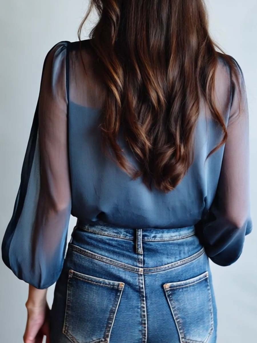 Women's blue floral print sheer button-up blouse back view