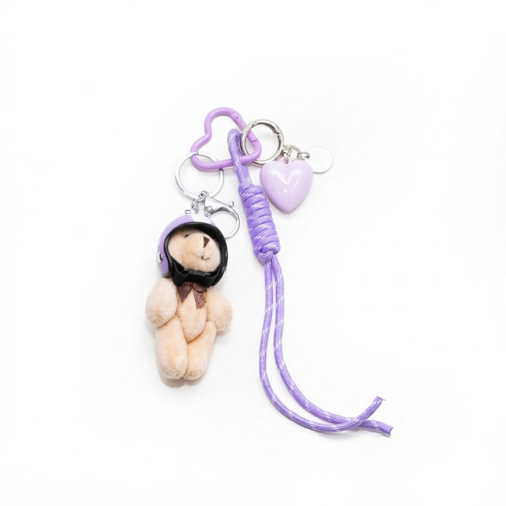 Purple pilot teddy bear bag charm with helmet, cord and heart